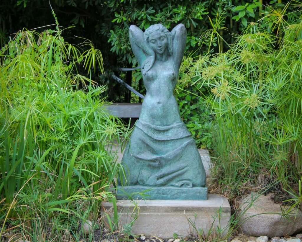 Rental property garden guide sculpture of woman